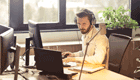 Man sitting at desk using computer